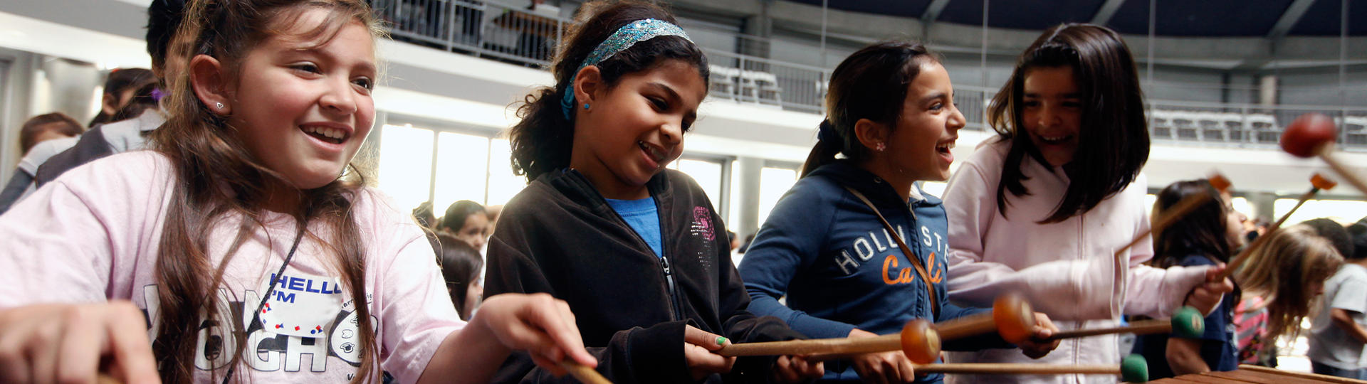 Young girls playing marimba