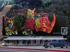 billboard showing a large artistically rendered rhinoceros