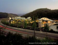 Skirball campus at dusk viewed from across the freeway