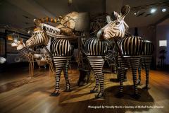 sculptures of 2 zebras, an elephant and a deer