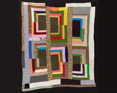 A quilt with six big colorful rectangular blocks