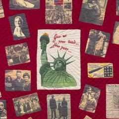 Detail of Ellis Island Quilt showing a red quilt with an image of the Statue of Liberty in the center surrounded by black and white photos of people