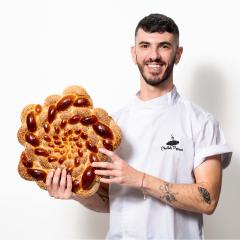 Ivan Chabasov, aka the Challah Prince, holds up braided bread while smiling at the camera. Beside his photo is a close-up shot of hands holding braided bread on a white table.