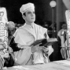 Sill from the 1927 film, The Jazz Singer, showing Al Jolson dressed and leading a Yom Kippur ceremony.