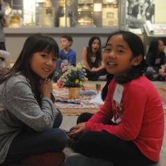 Two students on a school tour smile for the camera.